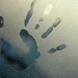 Handprint on foggy window by Sami Sarkis Photography