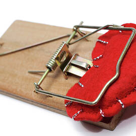 Heart-shape trapped in mouse trap by Sami Sarkis Photography