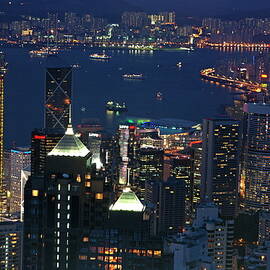 Kowloon skyline and Victoria Harbour at dusk by Sami Sarkis Photography