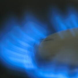 Lit blue gas ring by Sami Sarkis Photography