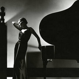Margaret Horan Posing Beside A Piano by Edward Steichen