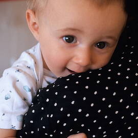 Mother holding baby girl by Sami Sarkis Photography