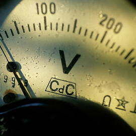 Numbers on the dial of a voltmeter by Sami Sarkis Photography