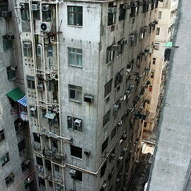 Old run-down concrete high-rise apartment buildings in Kowloon by Sami Sarkis Photography