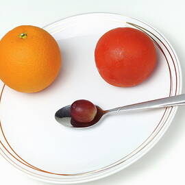 Plate and spoon with fruits by Sami Sarkis Photography