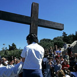 Priest leading prayer on a Good Friday procession outside Notre Dame de la Garde basilica  Marseille by Sami Sarkis Photography