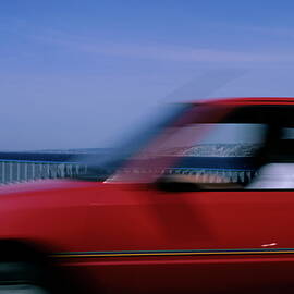 Red car speeding by Sami Sarkis Photography