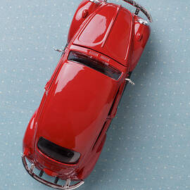 Red Volkswagen Beetle from above by Edward Fielding