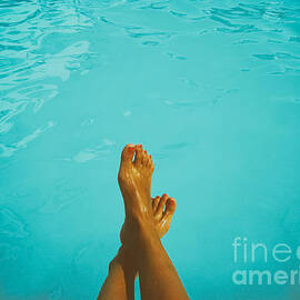 Retro Young Girl Relaxing Her Feet At Swimming Pool by Jessie Kean