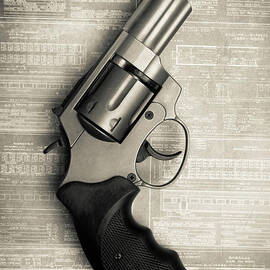 Revolver Pistol Gun over drawings by Edward Fielding