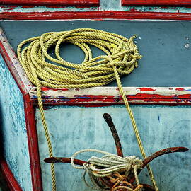 Ropes and rusty anchors on a boat deck by Sami Sarkis Photography
