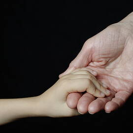 Senior woman and girl holding hands by Sami Sarkis Photography