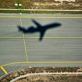 Shadow of an airplane taking off by Sami Sarkis Photography