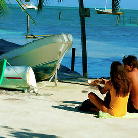 Sharing a coconut on Caye Caulker, Belize by Waterdancer