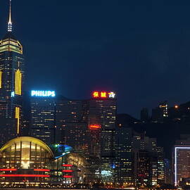 Skyline illuminated at night from Kowloon by Sami Sarkis Photography