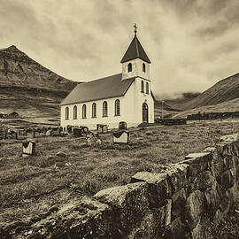 Small village church with cemetery in Gjogv, Faroe Islands, Denm by Miroslav Liska