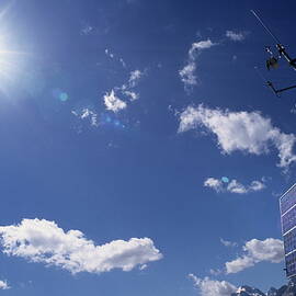 Solar panels and sun by Sami Sarkis Photography