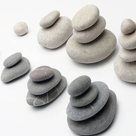 Stacks of white and gray pebbles by Sami Sarkis Photography