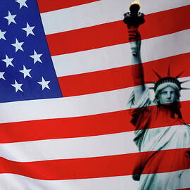 Statue of Liberty and US flag by Sami Sarkis Photography