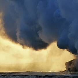 Steam rising off lava flowing into ocean at sunset by Sami Sarkis Photography