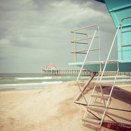 Stormy Huntington Beach Pier and Lifeguard Stand by Paul Velgos