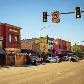Street view with stores and restaurants in Kalispell, Montana by Miroslav Liska