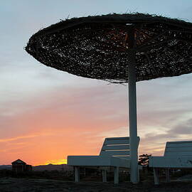Sun umbrella and loungers at sunset by Sami Sarkis Photography