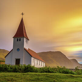 Sunrise over the lutheran church   in Vik, Iceland by Miroslav Liska