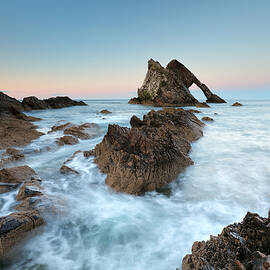 Sunset at Bow Fiddle Rock by Grant Glendinning