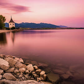 Sunset over a little church in Liptov, Slovakia by Miroslav Liska