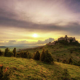 Sunset over the ruins of Spis Castle in Slovakia by Miroslav Liska