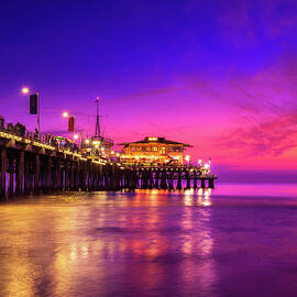 Sunset with many tourists at Santa Monica Pier in Los Angeles by Miroslav Liska