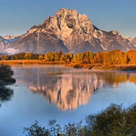 Teton Peaks In The Snake River by Adam Jewell