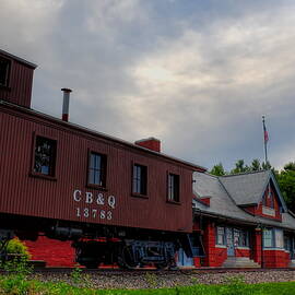 The Depot Under Cloudy Skies by Dale Kauzlaric