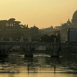 The Sant Angelo Bridge and the Papal Basilica of Saint Peter at sunset in Vatican City by Sami Sarkis Photography