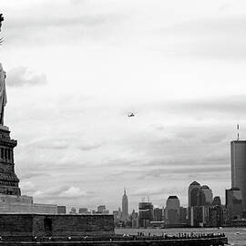 Tourists visiting the Statue of Liberty by Sami Sarkis Photography