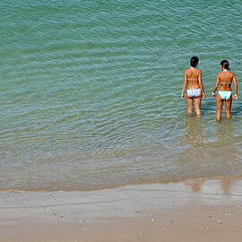 Two teenage girls bathing at the beach by Sami Sarkis Photography
