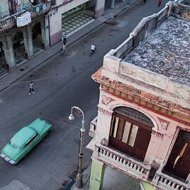 Vintage car driving through the streets of Havana by Sami Sarkis Photography