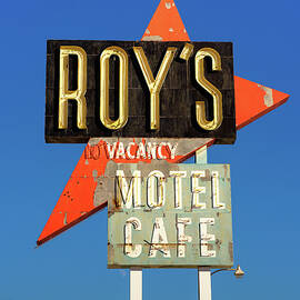 Vintage neon sign of Roy's motel and cafe on Route 66  by Miroslav Liska