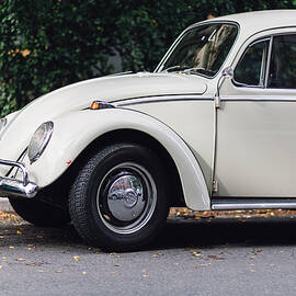 Volkswagen Beetle retro car at the city street by Aldona Sate
