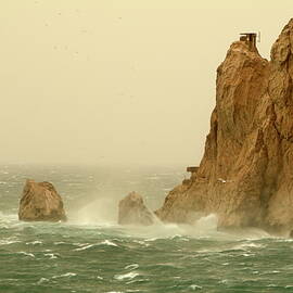 Waves crashing on island on a stormy day by Sami Sarkis Photography