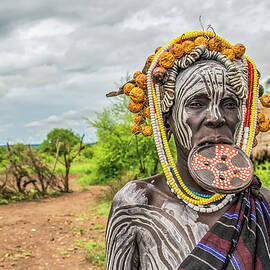 Woman from the african tribe Mursi, Omo Valley, Ethiopia by Miroslav Liska