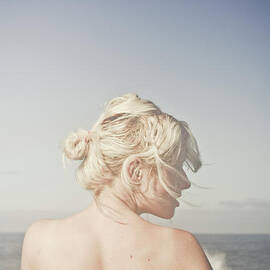 Woman relaxing on the beach by Jorgo Photography
