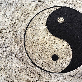 Yin and yang symbol on drum by Sami Sarkis Photography