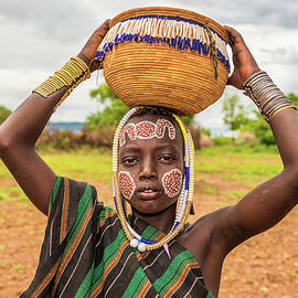 Young boy from the African tribe Mursi, Ethiopia by Miroslav Liska