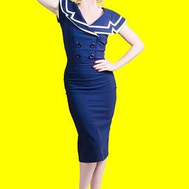 Young retro pinup girl wearing sailor uniform by Jorgo Photography