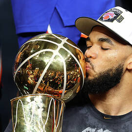 Karl-Anthony Towns Kisses the 2026 NBA Championship Trophy by Gregory Shamus