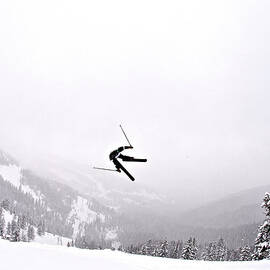 A Man Sideways In The Air On Teton by Derek Diluzio