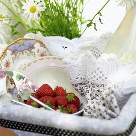 A Picnic Basket With Strawberries And Lemongrass Lemonade On A Bicycle by Hannah Kompanik