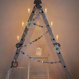 Alternative Christmas Tree Made From Folding Ladder And Take-away Cartons Used As Candle Lanterns by James Stokes